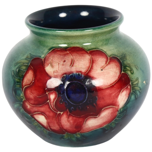 451 - MOORCROFT - a small anemone decorated tube-lined pot, H7cm