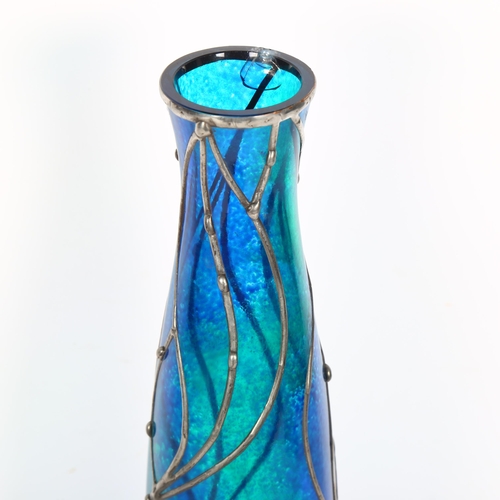 479 - An Art Nouveau style mottled blue glass vase with pewter overlay, indistinct signature, H35.5cm