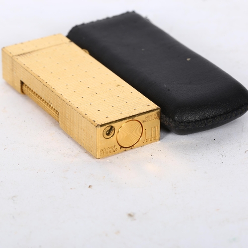 501 - A mid-century Dunhill lighter, with original leather sleeve