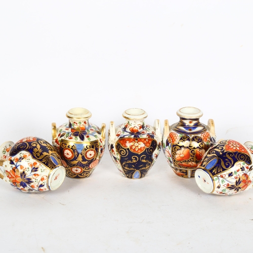 504 - A group of 5 x 19th century Derby and Imari decorated 2-handled pots, h8cm