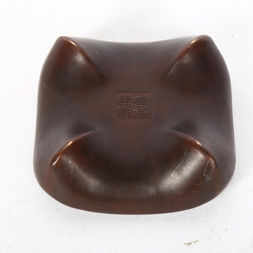 518 - A Chinese bronze dish, with embossed character mark to the underside