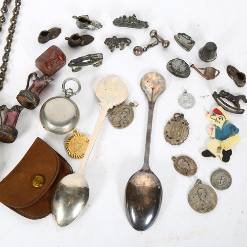 522 - A box of various items, including the Metropolitan patent whistle and chain, various religious fobs,... 