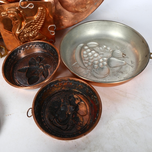 555 - A quantity of various Vintage French copper cake and jelly moulds, largest diameter 37cm