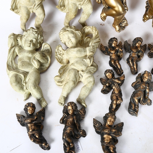 561 - A group of various plaster cast wall-hanging cherubs, largest 29cm (14)