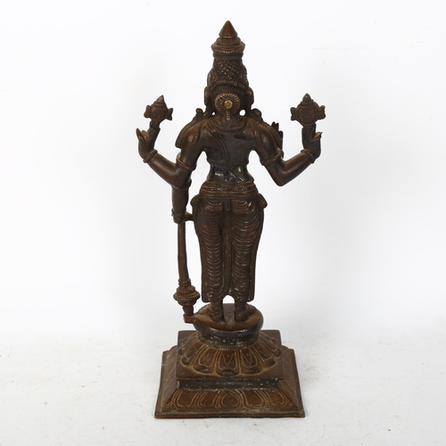 564 - A bronze sculpture of Indian deity Vishnu, on a stand with lotus leaf decoration, H31cm