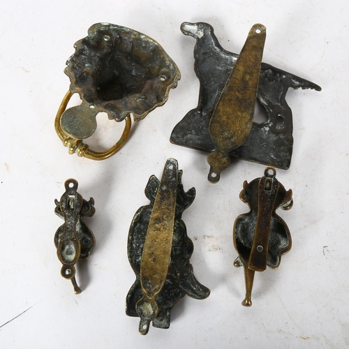 569 - A group of brass door knockers, to include an English Setter dog, L15cm, a lion mount, pixie on a to... 