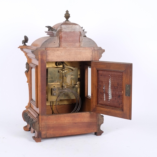 57 - A 19th century walnut-cased 8-day mantel clock, with square dial and silver chapter ring, with ormol... 