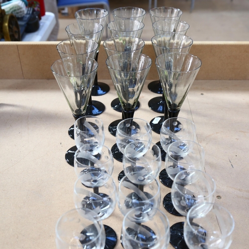 570 - A set of 12 Art Deco style black and white glasses, and a set of 19 engraved Art Deco goblets and ma... 