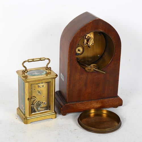 604 - A brass carriage clock, and an Edwardian inlaid lancet-top mantel clock, 22cm