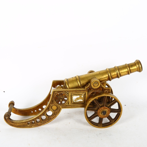 615 - A heavy cast-brass table cannon, L43cm overall