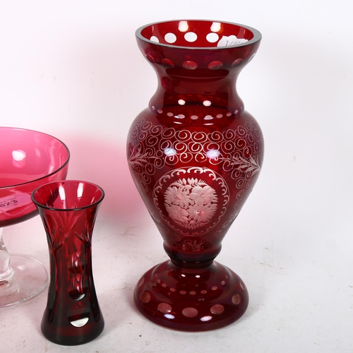 623 - A ruby overlay glass vase, 22cm, a pair of cranberry vases, and 2 cranberry coupes, with bulbous gla... 