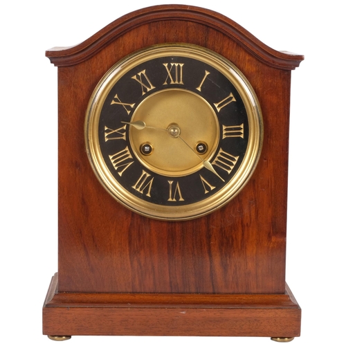 63 - An early 20th century walnut-cased dome-top mantel clock, with 8-day bell striking movement, black a... 