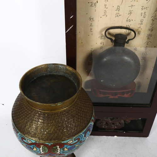 631 - A Chinese engraved patinated brass flask, mounted in lacquered glazed wall-hanging cabinet, height 5... 