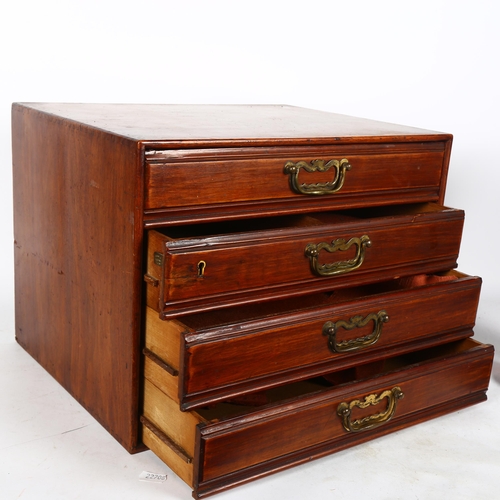 644 - A stained wood table-top cabinet of 4 long drawers, with brass drop handles, by Henry Stone & Son of... 