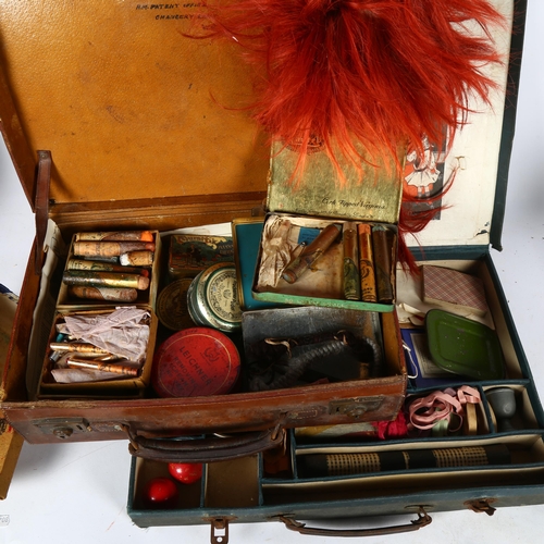 647 - A Gamages conjuring tricks outfit, and a leather case containing stage make-up etc