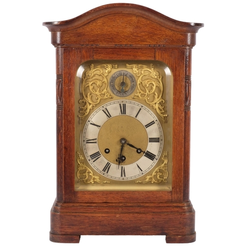 65 - An oak-cased mantel clock, with brass dial and silvered chapter ring, and a Gustov Becker 8-day chim... 