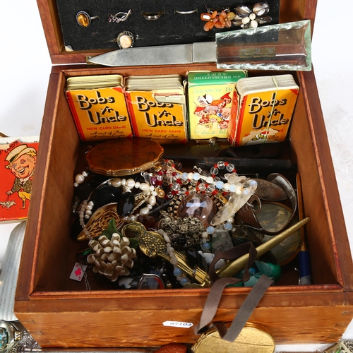 653 - Costume jewellery, compacts, playing cards, spectacles etc, in pine box