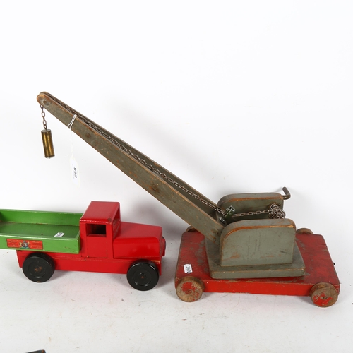 658 - A Chad Valley wooden tipper truck, L30cm, an RAF wooden truck, and a scratch built wooden crane.