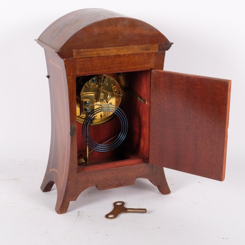 66 - An Art Nouveau mahogany and satinwood inlaid 8-day mantel clock, with enamelled dial, complete with ... 