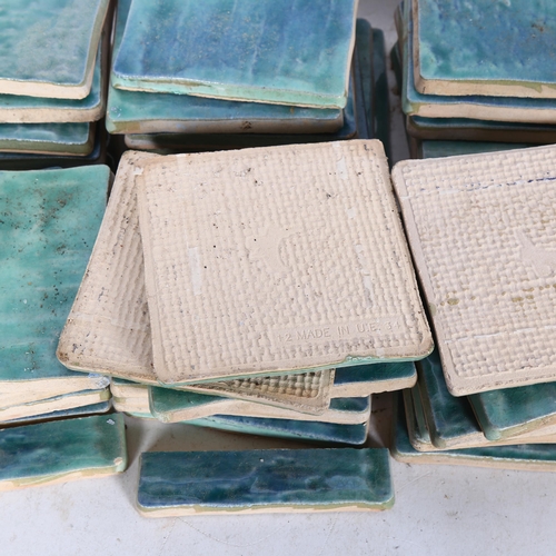 664 - A box of 43 glazed tiles, back stamped 