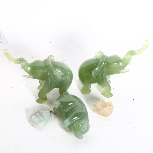 676 - A pair of carved jade elephants, 2 pigs, largest length 7cm, and a Buddha pendant