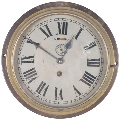69 - A brass-cased ship's bulkhead clock, overall diameter 24cm
