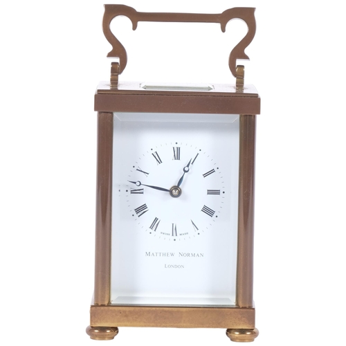 73 - Matthew Norman, London, a brass-cased carriage clock, case height not including handle 11cm, complet... 