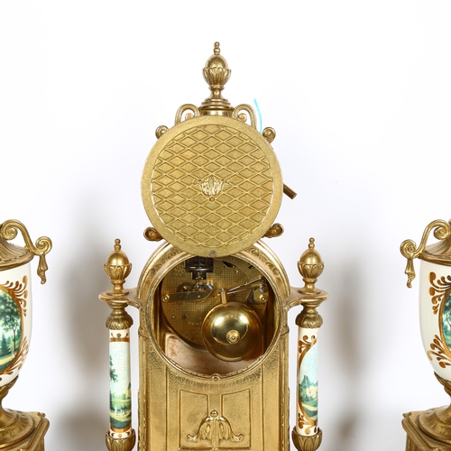 730 - An impressive 3-piece clock garniture, gilt-metal frames, with ceramic pillars, with transfer print ... 