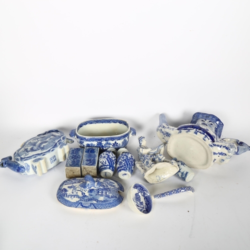 734 - A quantity of blue and white Chinese ceramic ware, including a peg leg figural Toby jug style teapot... 