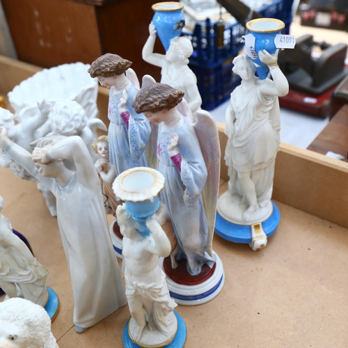 735 - A group of Continental porcelain and ceramic figurines, including various ornamental candlesticks, s... 