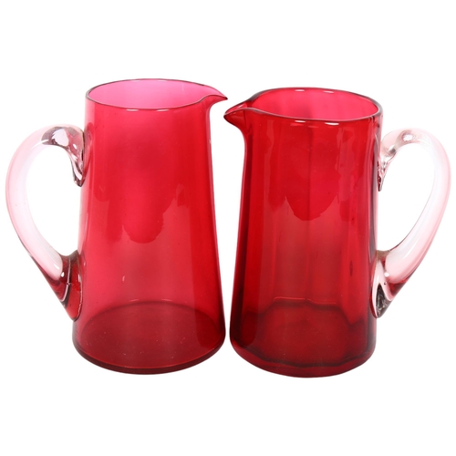 757 - A pair of Whitefriars cranberry glass jugs, 21cm