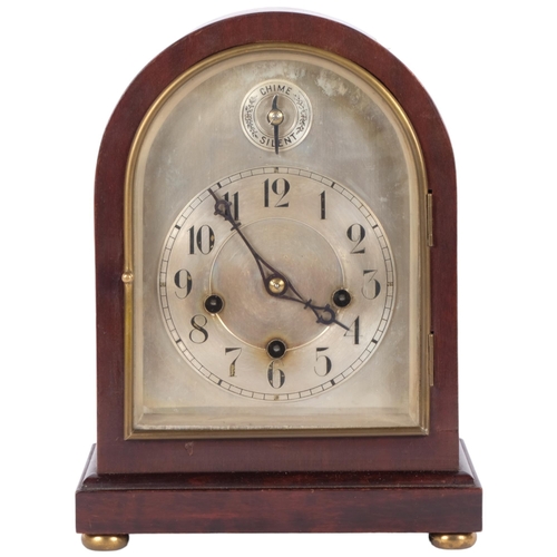 76 - An Edwardian dome-top mantel clock with silvered chapter ring, 8-day gong striking movement, complet... 