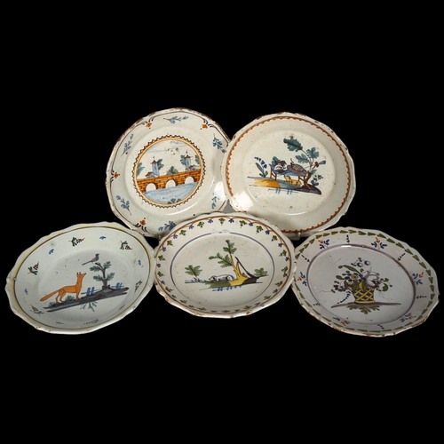 762 - 5 various faience tin-glazed earthenware shallow dishes, with painted designs, 22.5cm