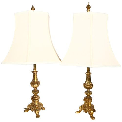 763 - A pair of cast gilt-brass twin light table lamps, with matching shades, H64cm