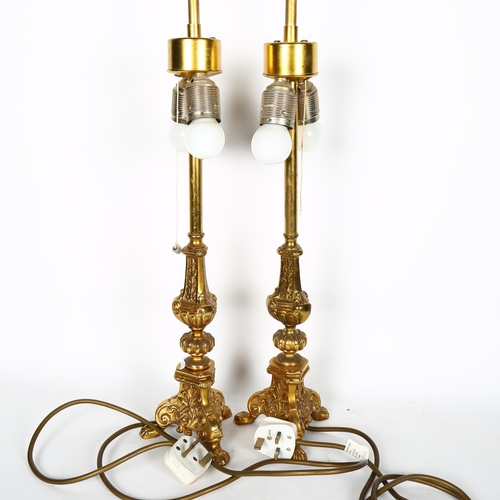 763 - A pair of cast gilt-brass twin light table lamps, with matching shades, H64cm