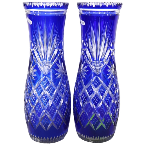 766 - A pair of blue overlay cut-crystal vases (1 has chips to rim)