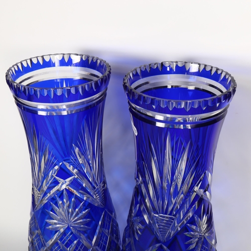 766 - A pair of blue overlay cut-crystal vases (1 has chips to rim)