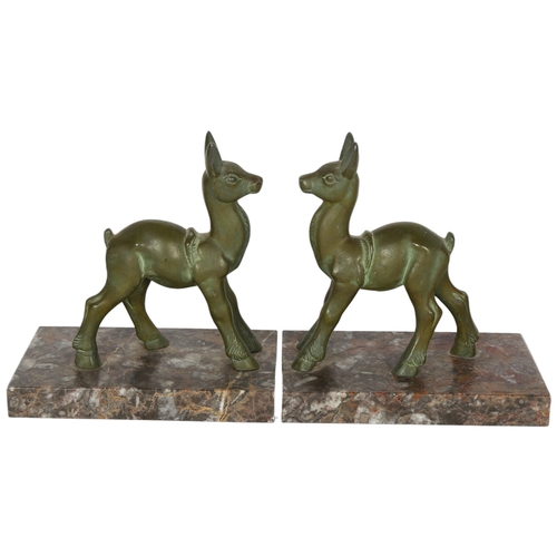 774 - A pair of Art Deco Faun verdigris metal bookends on marble plinths, H16.5cm