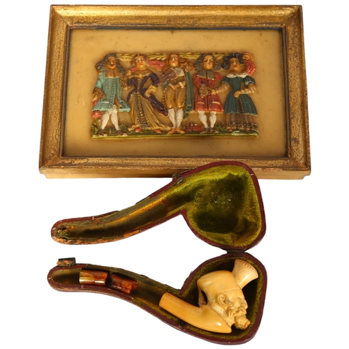 775 - An Antique Meerschaum pipe (A/F), and a moulded and painted wax study of figures, 12.5cm x 17.5cm