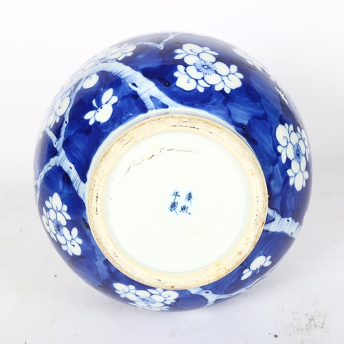 797 - A Chinese blue and white Prunus pattern vase, with 4 character mark, H35cm, repaired rim chip and cr... 