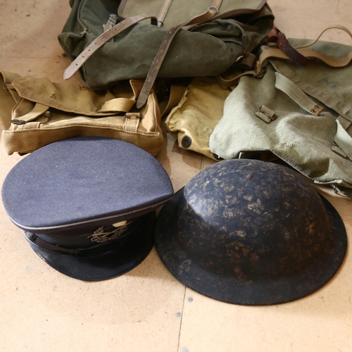 804 - Second World War helmet, canvas bags, rucksack, and a German military cap