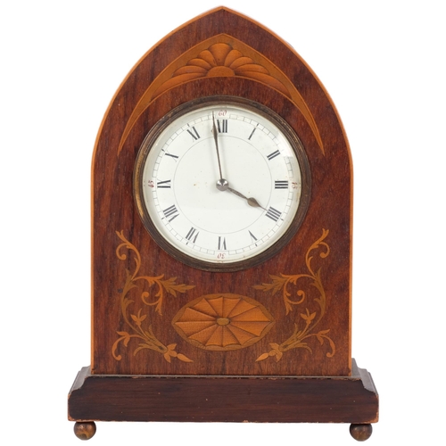 81 - An inlaid mahogany clock with curved top and French 8-day movement, H24cm