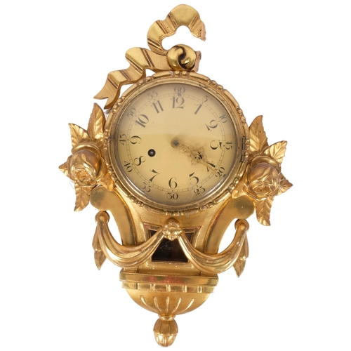 86 - A giltwood cartel clock, enamelled dial, 8-day bell striking movement, with pendulum but no key, clo... 