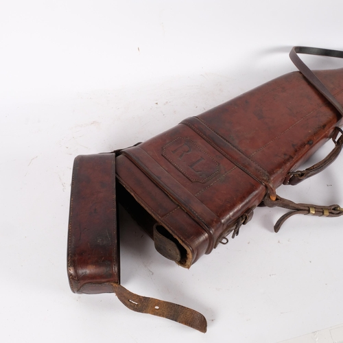 87 - A 19th century brown leather leg-of-mutton shotgun case, complete with shoulder strap and handle, wi... 