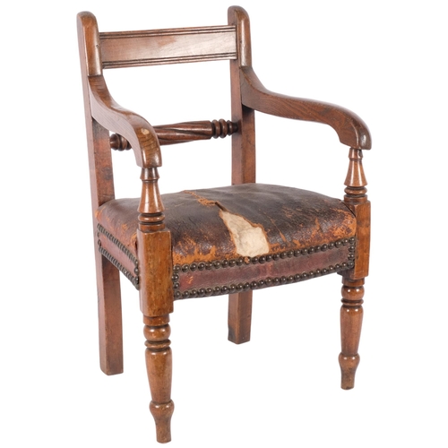 95 - A 19th century mahogany child's elbow chair with studded seat