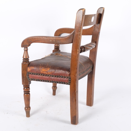 95 - A 19th century mahogany child's elbow chair with studded seat