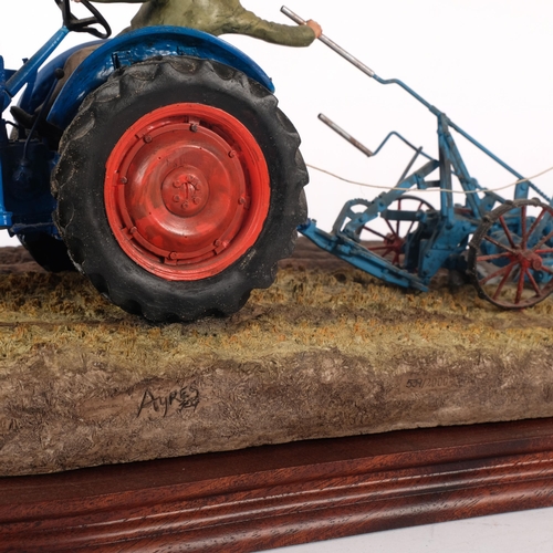 919 - Border Fine Arts sculpture of man and tractor 