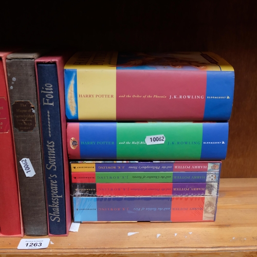 1001 - A collection of folio books, and 6 Harry Potter hardback books