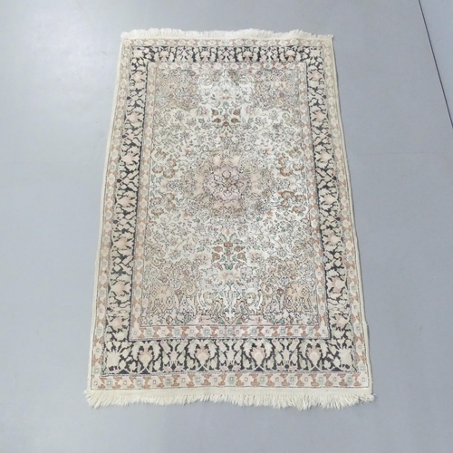 2119 - A cream-ground Persian rug. 151x94cm.