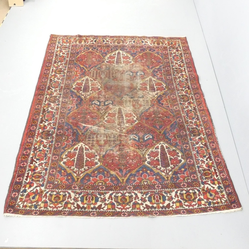 2120 - A red-ground Persian Bakhtiari rug. 205x160cm.